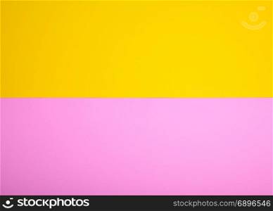 two sheets of paper, yellow and pink background