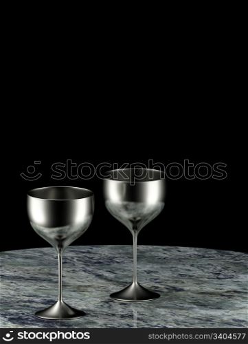 Two silver goblets on marble table
