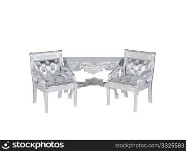 two silver leather upholstery chairs with silver table on middle