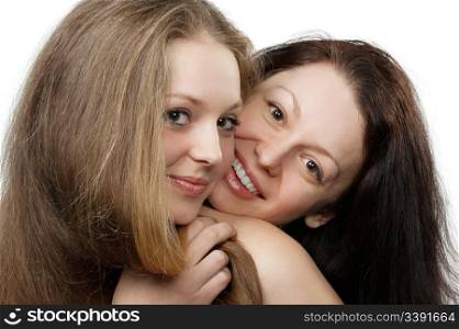 Two sisters. A portrait of two young attractive girls.Isolated on white