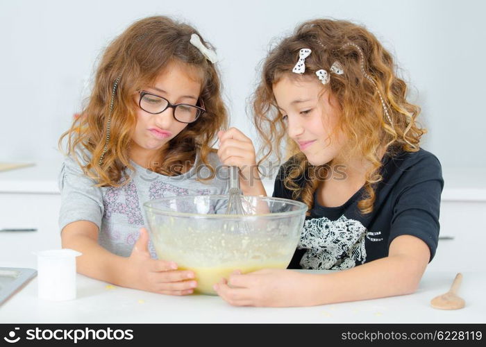 Two sisters baking