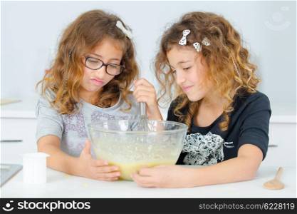Two sisters baking