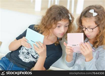 Two sisters playing a video game