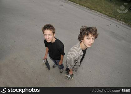 two skate boarders - top view perspective