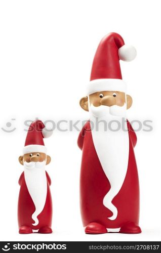 two slender santa figurines. two slender santa figurines on white background