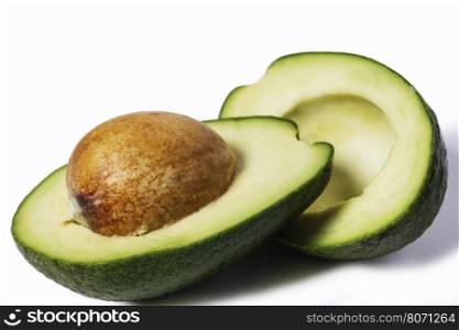 Two slices of avocado isolated on a white background. One slice with core. Design element for product label, catalog print, web use.