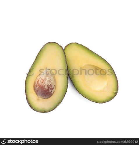 Two slices of avocado isolated on the white background. One slice with core.. Two slices of avocado isolated on the white background. One slice with core. Design element for product label.