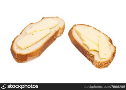 two slices of wheaten bread spreaded with butter