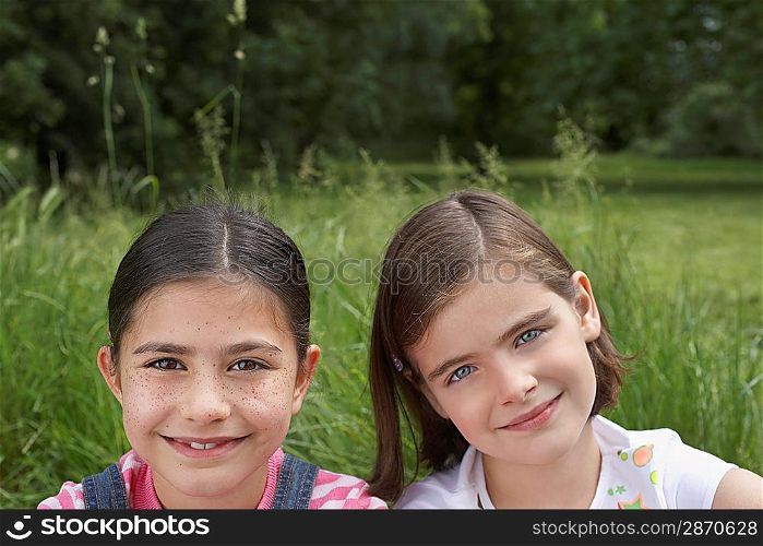 Two Smiling Girls Outside