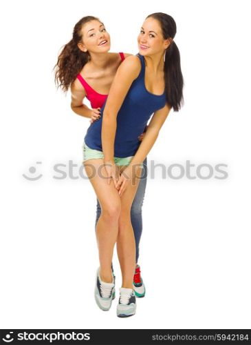 Two smiling sporty girls isolated