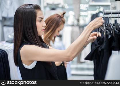 Two smiling young woman Asian with shopping and buy at mall/supermarket/market