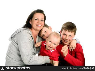 Two Sons Sit next to their mother on the White Background