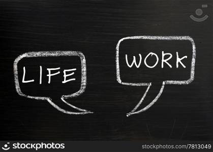 Two speech bubbles for life and work drawn with chalk on a blackboard