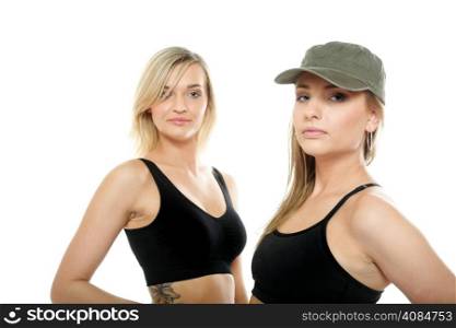 Two sporty women in military caps isolated on white background.