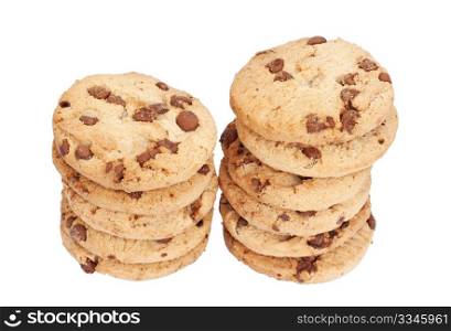 Two stacks of chocolate chip biscuits isolated over a white background.