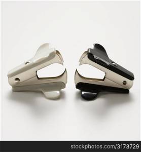 Two staple removers on white background.