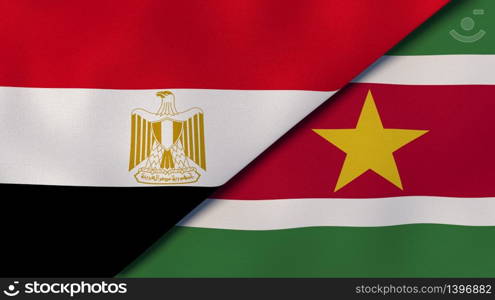 Two states flags of Egypt and Suriname. High quality business background. 3d illustration. The flags of Egypt and Suriname. News, reportage, business background. 3d illustration