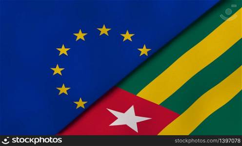 Two states flags of European Union and Togo. High quality business background. 3d illustration. The flags of European Union and Togo. News, reportage, business background. 3d illustration