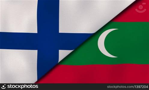 Two states flags of Finland and Maldives. High quality business background. 3d illustration. The flags of Finland and Maldives. News, reportage, business background. 3d illustration