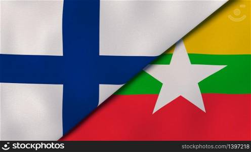 Two states flags of Finland and Myanmar. High quality business background. 3d illustration. The flags of Finland and Myanmar. News, reportage, business background. 3d illustration
