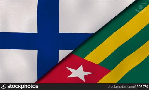 Two states flags of Finland and Togo. High quality business background. 3d illustration. The flags of Finland and Togo. News, reportage, business background. 3d illustration