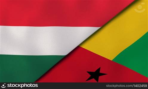 Two states flags of Hungary and Guinea Bissau. High quality business background. 3d illustration. The flags of Hungary and Guinea Bissau. News, reportage, business background. 3d illustration