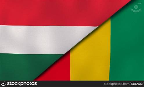 Two states flags of Hungary and Guinea. High quality business background. 3d illustration. The flags of Hungary and Guinea. News, reportage, business background. 3d illustration