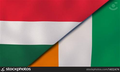 Two states flags of Hungary and Ivory Coast. High quality business background. 3d illustration. The flags of Hungary and Ivory Coast. News, reportage, business background. 3d illustration
