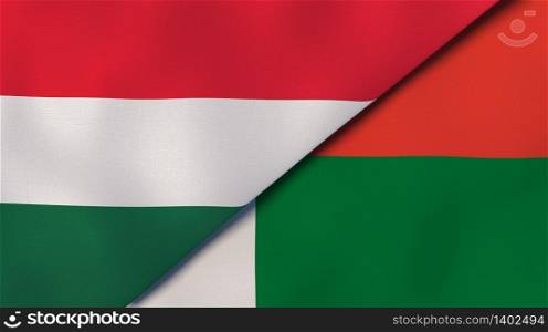 Two states flags of Hungary and Madagascar. High quality business background. 3d illustration. The flags of Hungary and Madagascar. News, reportage, business background. 3d illustration