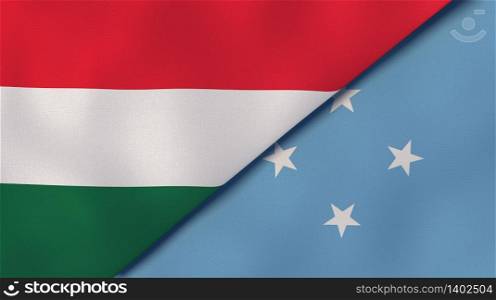 Two states flags of Hungary and Micronesia. High quality business background. 3d illustration. The flags of Hungary and Micronesia. News, reportage, business background. 3d illustration