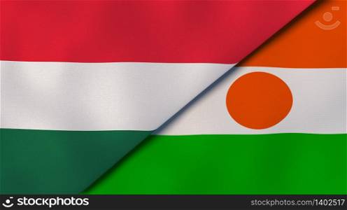 Two states flags of Hungary and Niger. High quality business background. 3d illustration. The flags of Hungary and Niger. News, reportage, business background. 3d illustration