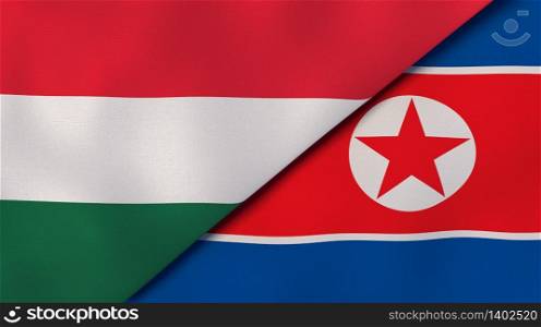 Two states flags of Hungary and North Korea. High quality business background. 3d illustration. The flags of Hungary and North Korea. News, reportage, business background. 3d illustration