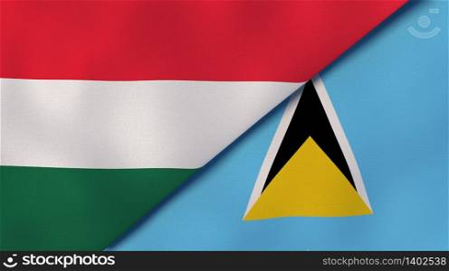 Two states flags of Hungary and Saint Lucia. High quality business background. 3d illustration. The flags of Hungary and Saint Lucia. News, reportage, business background. 3d illustration