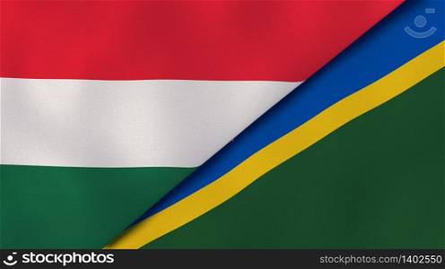 Two states flags of Hungary and Solomon Islands. High quality business background. 3d illustration. The flags of Hungary and Solomon Islands. News, reportage, business background. 3d illustration