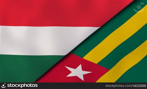 Two states flags of Hungary and Togo. High quality business background. 3d illustration. The flags of Hungary and Togo. News, reportage, business background. 3d illustration