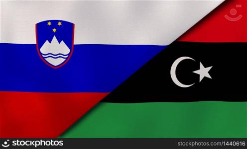 Two states flags of Slovenia and Libya. High quality business background. 3d illustration. The flags of Slovenia and Libya. News, reportage, business background. 3d illustration