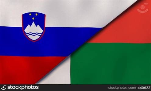 Two states flags of Slovenia and Madagascar. High quality business background. 3d illustration. The flags of Slovenia and Madagascar. News, reportage, business background. 3d illustration