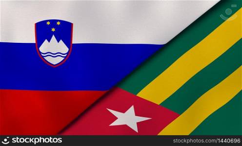 Two states flags of Slovenia and Togo. High quality business background. 3d illustration. The flags of Slovenia and Togo. News, reportage, business background. 3d illustration