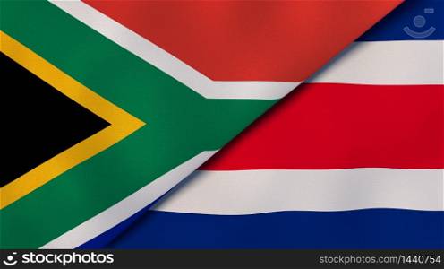 Two states flags of South Africa and Costa Rica. High quality business background. 3d illustration. The flags of South Africa and Costa Rica. News, reportage, business background. 3d illustration