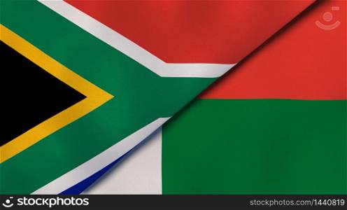 Two states flags of South Africa and Madagascar. High quality business background. 3d illustration. The flags of South Africa and Madagascar. News, reportage, business background. 3d illustration