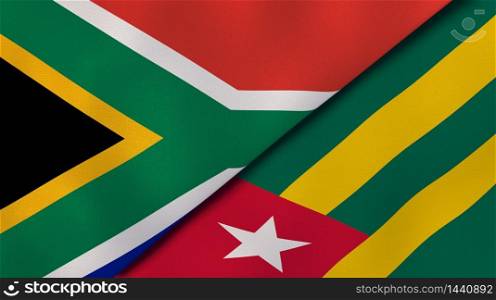 Two states flags of South Africa and Togo. High quality business background. 3d illustration. The flags of South Africa and Togo. News, reportage, business background. 3d illustration