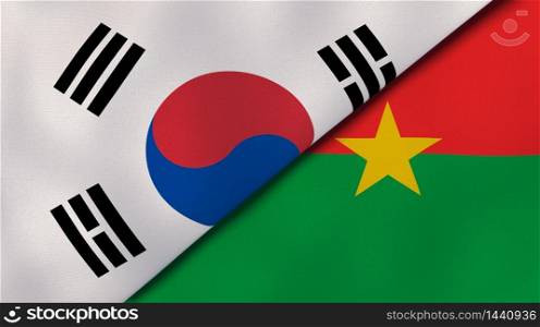 Two states flags of South Korea and Burkina Faso. High quality business background. 3d illustration. The flags of South Korea and Burkina Faso. News, reportage, business background. 3d illustration