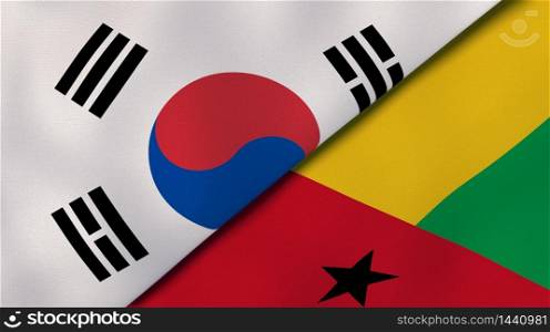 Two states flags of South Korea and Guinea Bissau. High quality business background. 3d illustration. The flags of South Korea and Guinea Bissau. News, reportage, business background. 3d illustration