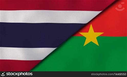Two states flags of Thailand and Burkina Faso. High quality business background. 3d illustration. The flags of Thailand and Burkina Faso. News, reportage, business background. 3d illustration