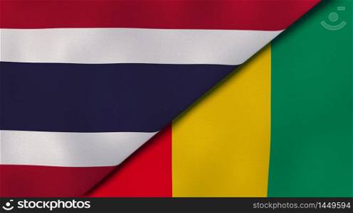Two states flags of Thailand and Guinea. High quality business background. 3d illustration. The flags of Thailand and Guinea. News, reportage, business background. 3d illustration