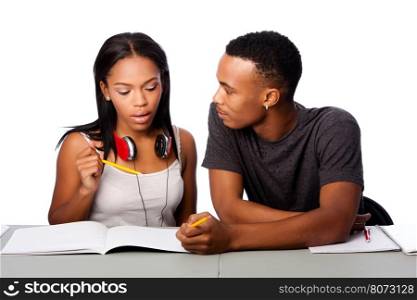Two students happily studying together, on white.