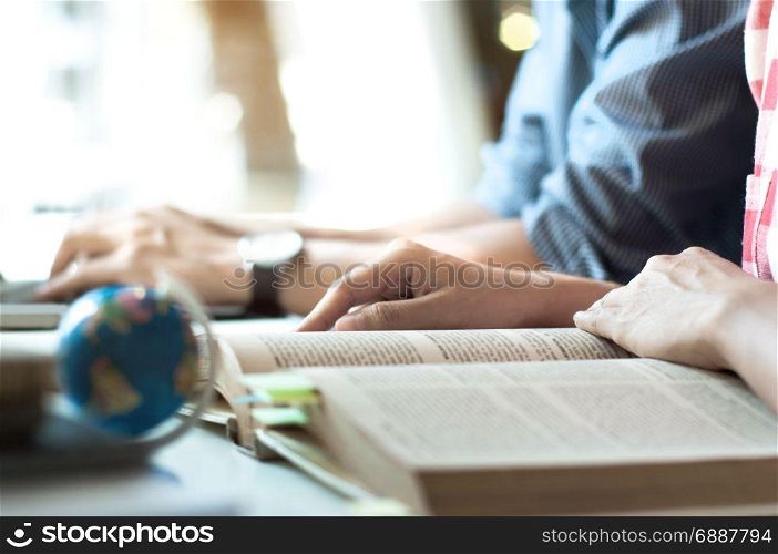 two students reading a books
