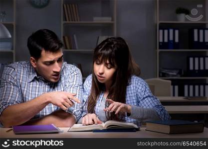 Two students studying late at night