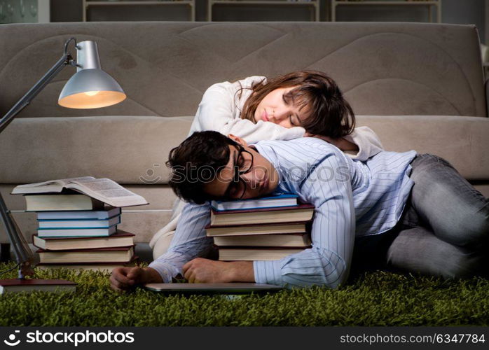 Two students studying late preparing for exams