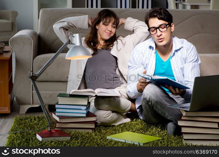 Two students studying late preparing for exams